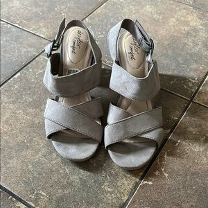 Gray Sandals with Crisscross Straps.